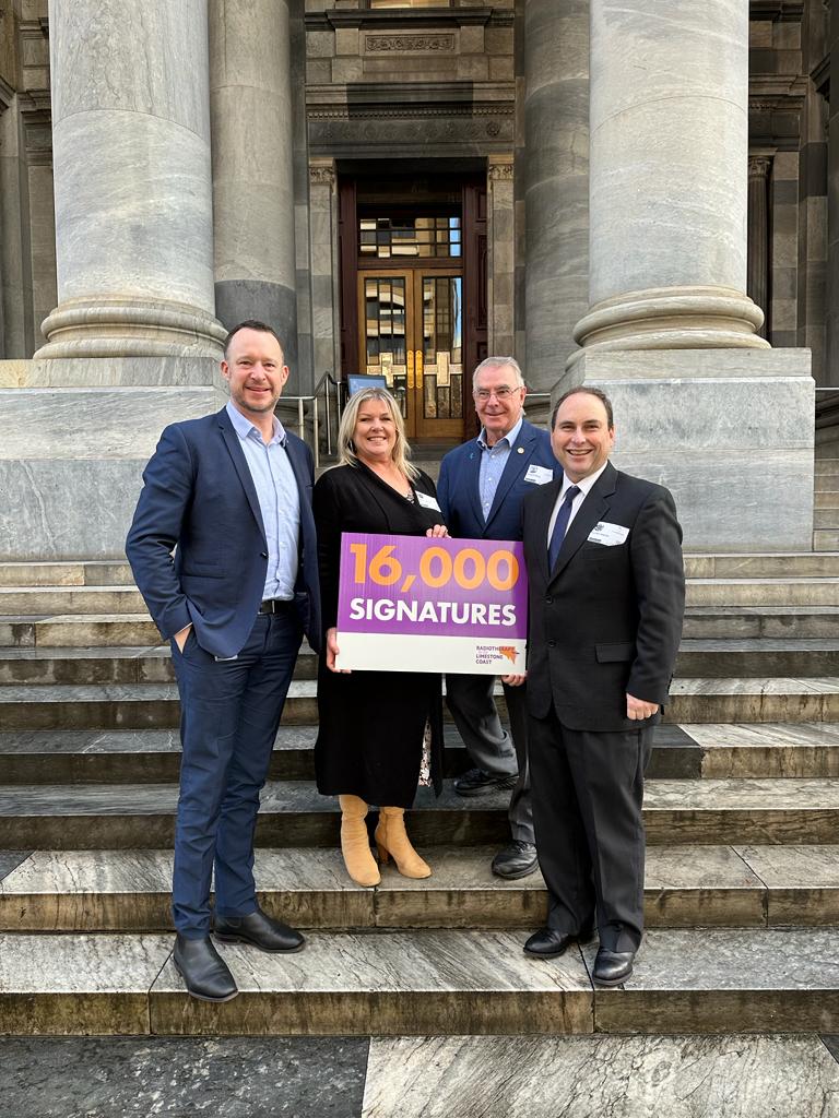 Naracoorte raised MLC Ben Hood, Deanne Carmondy, Richard Harry and Naracoorte's Lachlan Haynes on the steps of parliament house where an inquiry is underway regarding radiation services in the South East following a petition with 16,000 hard copy signatures.